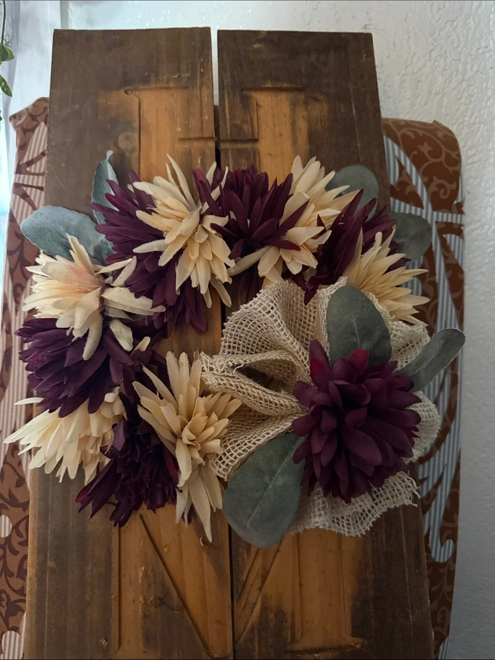 Wooden 'NE' Wall Sign with Burgundy and Cream Faux Floral Wreath